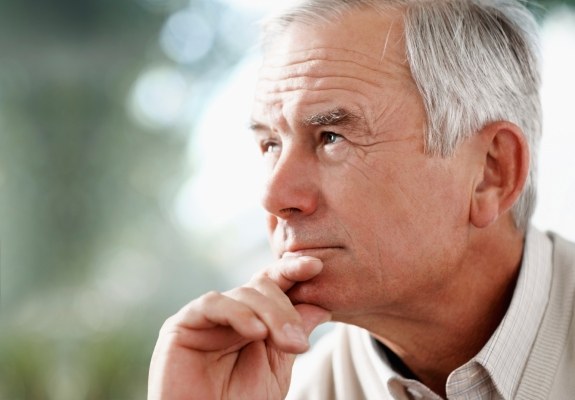 Older man consider dental implant tooth replacement