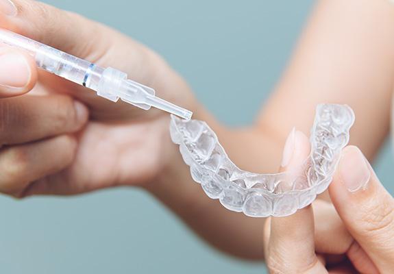 Whitening gel applied to a tooth mold in preparation for being placed in the mouth